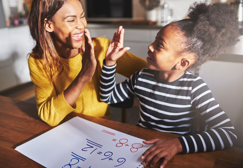 mom and child high fiving